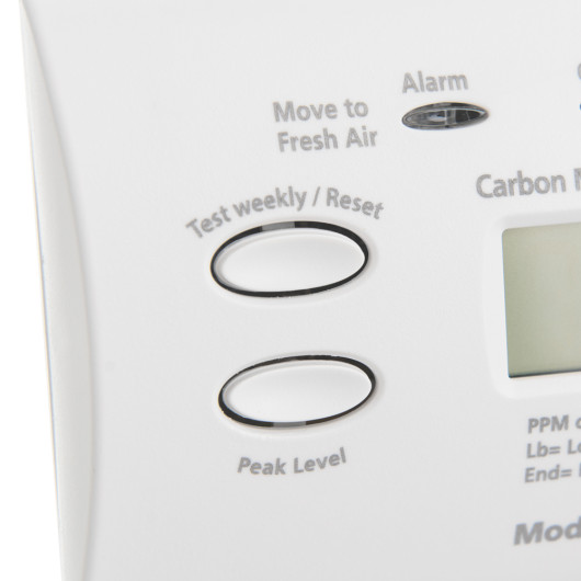 Closeup of buttons labelled Test weekly Reset and Peak Level on kidde co digital alarm