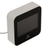 kidde mains carbon dioxide air quality monitor shown from an angled down view with a black front screen and white casing
