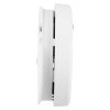 A side view of a white circular smoke alarm showing its curved profile and vent openings for airflow.