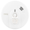 Front view of Kidde Firex mains powered heat alarm with alkaline battery backup showing circular white casing and central button