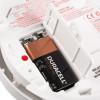 Close-up of the Kekf31 Kidde Firex Kf31 Mains Heat Alarm Alkaline Backup Battery compartment showing a Duracell 9V battery installed