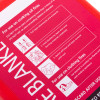 angled close up of a red kidde 1m fire blanket packet showing white text and simple illustrations explaining use on cooking oil and clothing fires