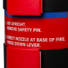 Close up of clasps on the Kidde 2kg powder extinguisher showing red safety lever and instruction text