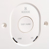 a close up of the multifunction test / hush button