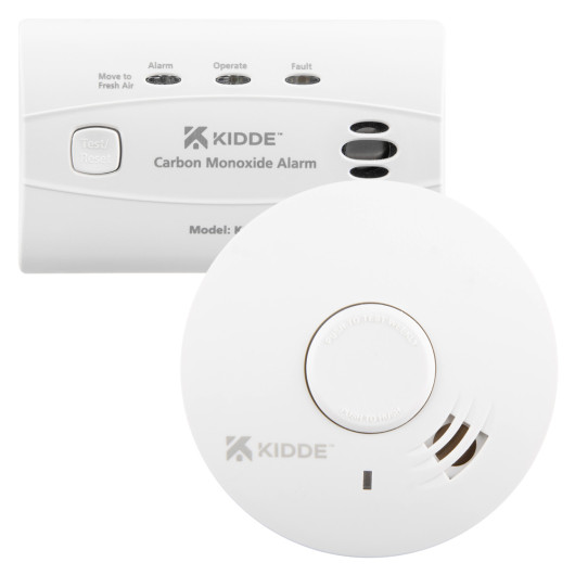 A Kidde carbon monoxide alarm with status lights and a test/reset button shown above a round Kidde smoke alarm with a central test/hush button.