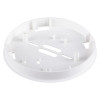 An angled view of a white circular alarm mounting base showing its raised edges, internal mounting posts, and multiple cut-outs for wiring and screw positioning.