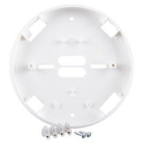 A white circular alarm mounting base shown with included installation accessories, including terminal blocks and two metal screws placed in front of the base.