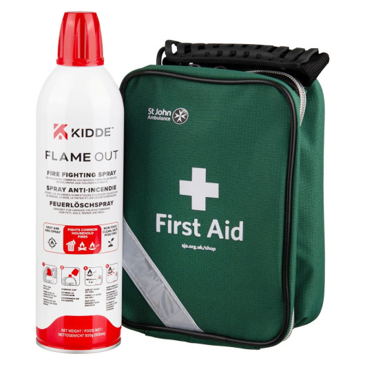 Kidde Flame Out fire‑fighting spray next to a green St John Ambulance first aid kit with a white cross and zip closure