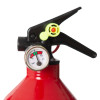 A close‑up of a fire extinguisher pressure gauge showing the needle in the green zone, with handle, lever, and safety pin visible