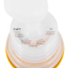 Close up top view of an anti choking device showing the shape and printed labels on its surface