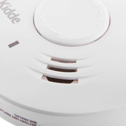 Close-up of the white Kidde Ke10Y29 85Db Alarm showing the test button and vent openings