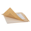 Closeup of an adhesive sticker pad with a peeled-back protective sheet showing the sticky surface underneath