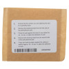 Adhesive sticker pad showing front side with instructions on a brown paper backing