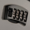 Close up of the master lock 5403 key safe showing the combination dials and the casing slightly open