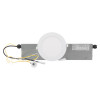 Round recessed emergency downlight meled showing a circular light fixture attached to a rectangular metal housing with wires visible