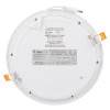 Round recessed emergency downlight meled shown from the back with labels and mounting clips visible