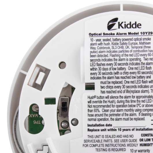 Close-up of the Kidde Ke10Y29 On Off Switch mounted inside a smoke alarm unit showing the switch and information label