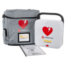 physio control lifepak cr2 trainer unit showing the main device, a grey carry case with heart logo, and an instruction manual
