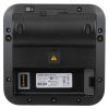 The back of a black defibrillator showing the battery connector and the serial number