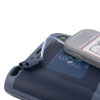 A dark and light blue defibrillator with grey electrode pads sat on top