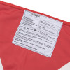 Close up of promove child evacuation sling label showing care instructions and warnings on a white fabric patch