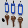 Keys hanging on hooks with blue labels attached, part of phoenix fire fighter 0442 electronic lock