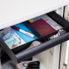 Internal drawer of the phoenix titan 1281 safe showing assorted items including a passport watches and currency