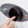 Fingerprint lock being used on the phoenix titan 1281 safe showing a finger pressing a button