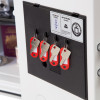 phoenix titan 1282 safe key rack holding four keys with red tags on black panel inside white safe door
