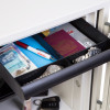 Open drawer of phoenix titan 1282 key lock showing contents including passport watches pen and currency