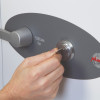 Hand inserting a key into the front of a phoenix titan 1282 key lock in use