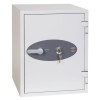 cream safe with door shut and key in lock on white background
