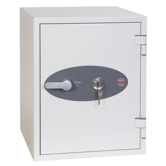 cream safe with door shut and key in lock on white background