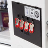 Keys hanging inside the phoenix titan 1283 key lock with red labels on hooks inside a black panel
