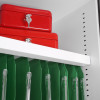 Red phoenix fire ranger 1511 electronic lock boxes stacked on white shelf above green hanging files inside cabinet