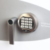 Close up of the Phoenix Fire Commander Pro FS1923 electronic lock keypad and handle in silver finish