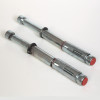 Close up of the floor fixing kit for the phoenix fire commander pro fs1923 electronic lock showing two metal fixings with red caps