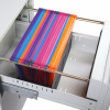 angled view of phoenix world class vertical fire file key lock showing multicoloured hanging file folders inside a white drawer