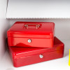 phoenix hs1091 diamond deposit security safe key lock in bright red with two cash boxes stacked on a shelf