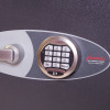 Close up of the electronic lock on the phoenix mecury hs2054 security safe with keypad buttons and handle