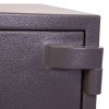 Close up of the hinge on the phoenix mercury hs2054 security safe showing textured dark metal surface