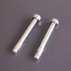 Two bolt down screws for the phoenix elara hs3553 security safe shown on a grey surface