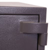 Close-up of the hinge on the phoenix elara hs3553 security safe showing its textured metal surface