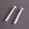 Close-up of two silver bolt down screws included with the phoenix elara hs3555 security safe
