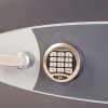 Close up of the electronic lock on the phoenix elara hs3555 security safe showing the keypad and handle