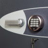 Close up of the electronic lock on phoenix planet hs6071 security safe showing keypad and handle