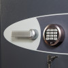 Close up of the electronic lock and handle on the phoenix planet hs6072 security safe