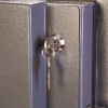 phoenix planet hs6072 security safe internal key lock with a key inserted in the lock cylinder