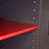 Red internal shelf inside the phoenix planet hs6072 security safe showing shelf supports on the side panel
