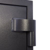 Close-up of the hinge on the phoenix planet hs6073 security safe showing textured dark metal